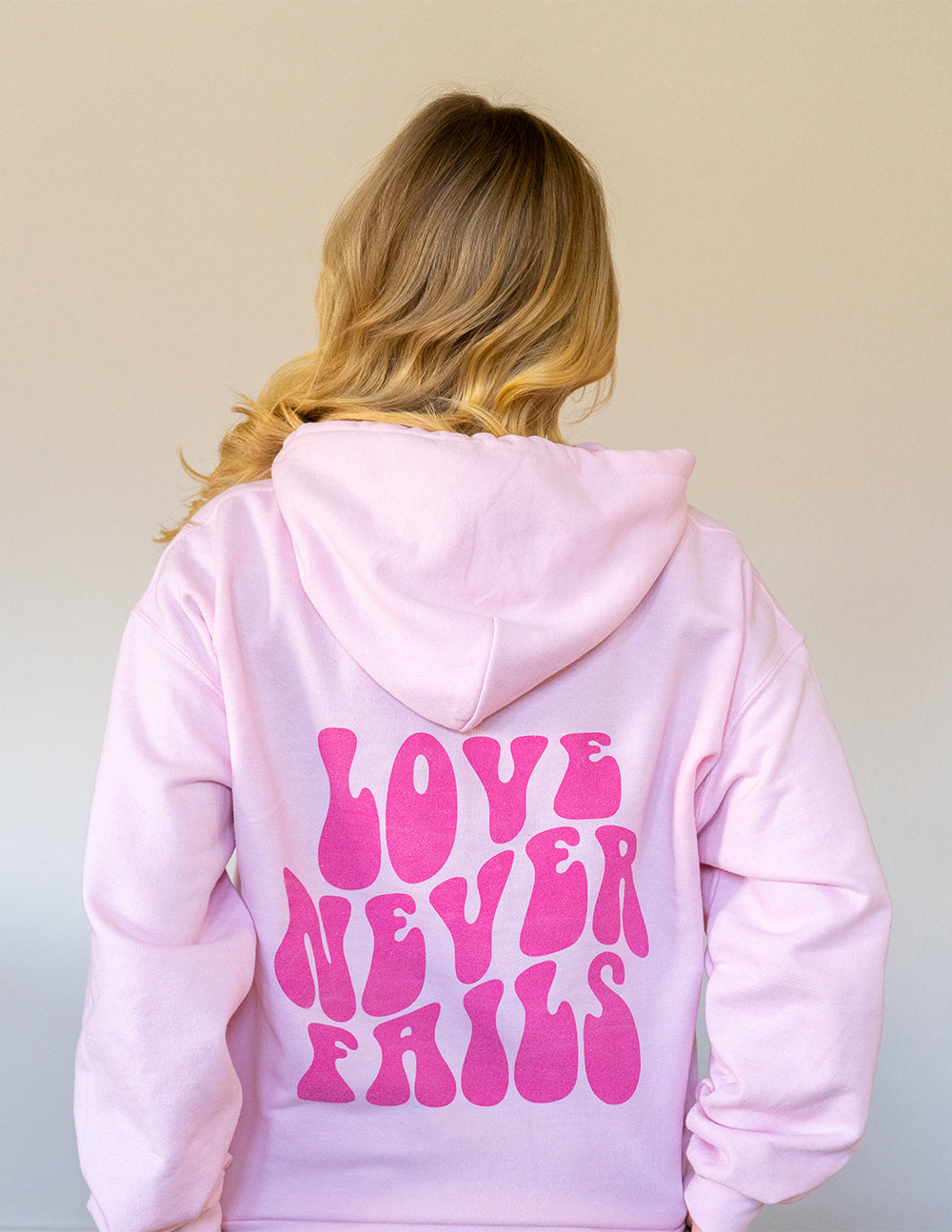 Love Never Fails  Pink Hoodie – worthapparelco